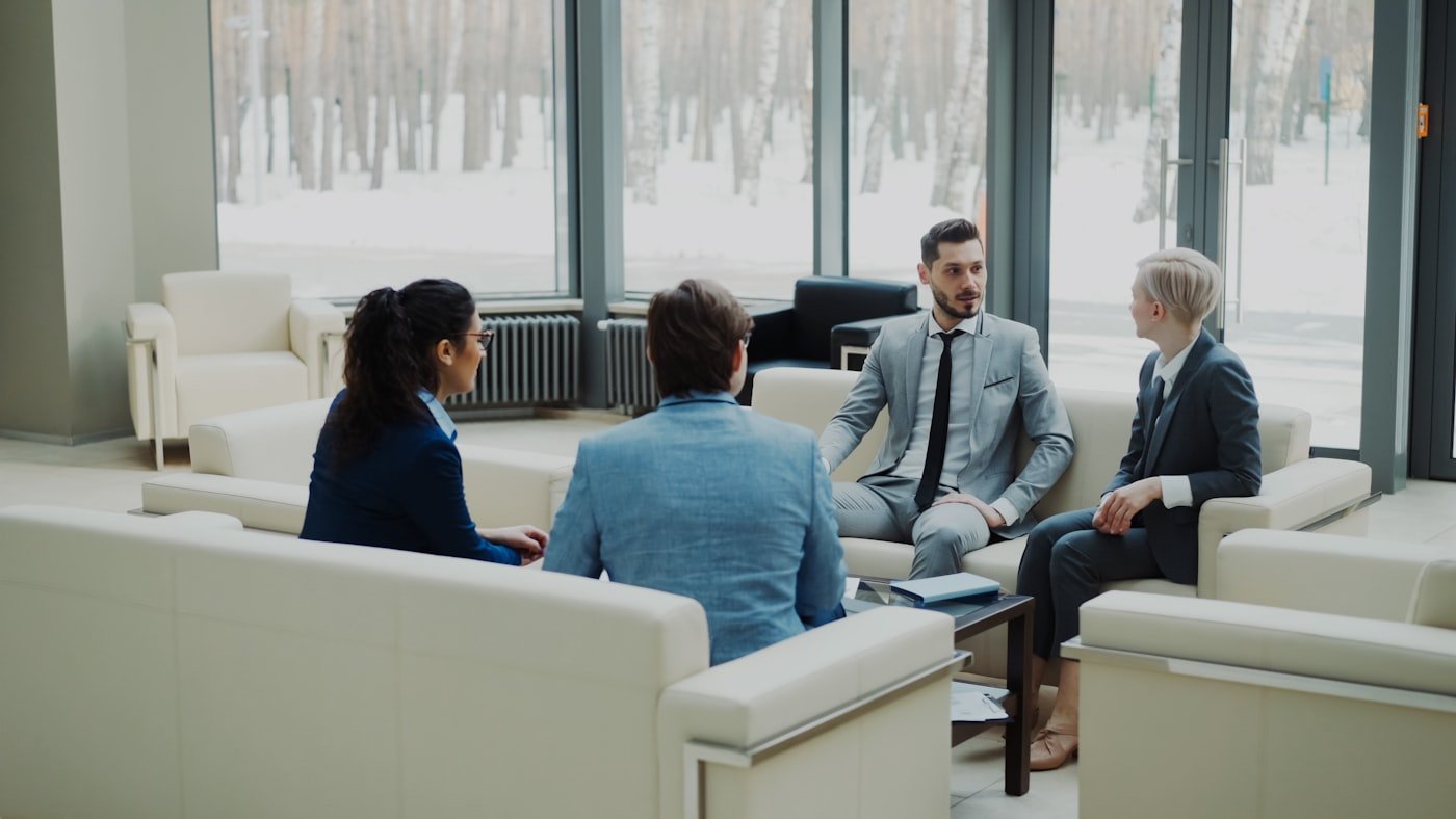 Business partners in discussion inside a modern office