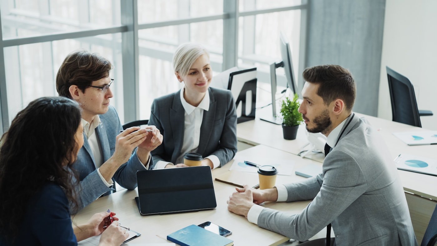 Business partners discussing agreement in a modern office